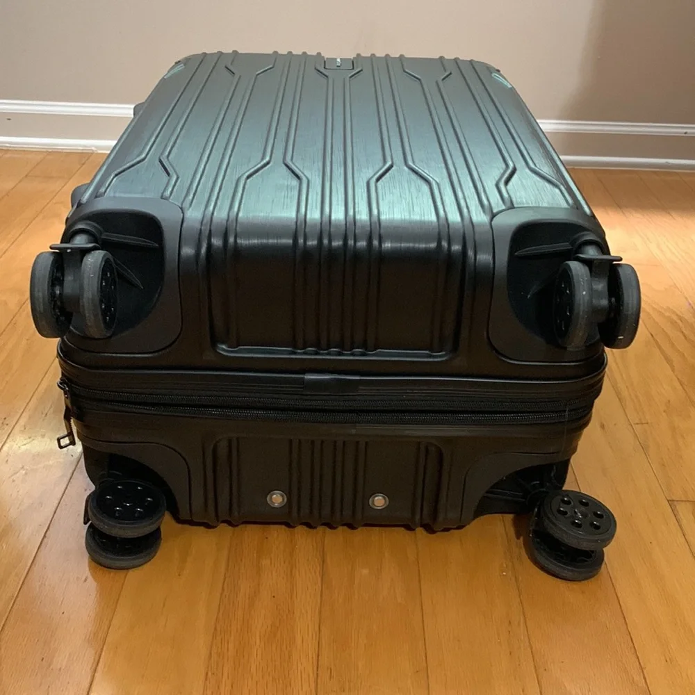 Traveler’s Choice Black Hard-case 24” Suitcase